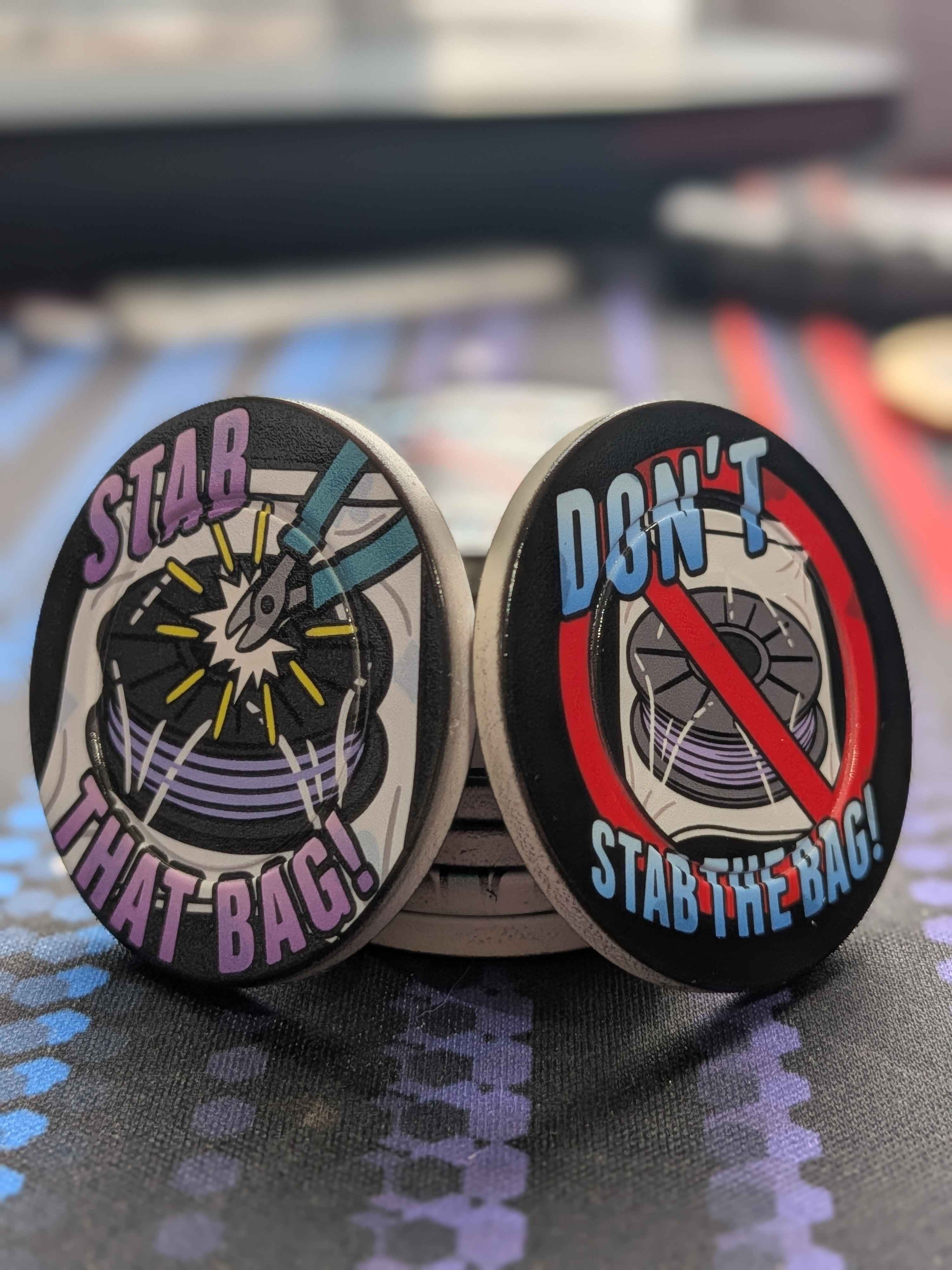 Stab The Bag and Don't Stab The Bag coins